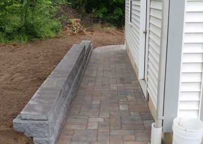 Paver walkway with retaining wall